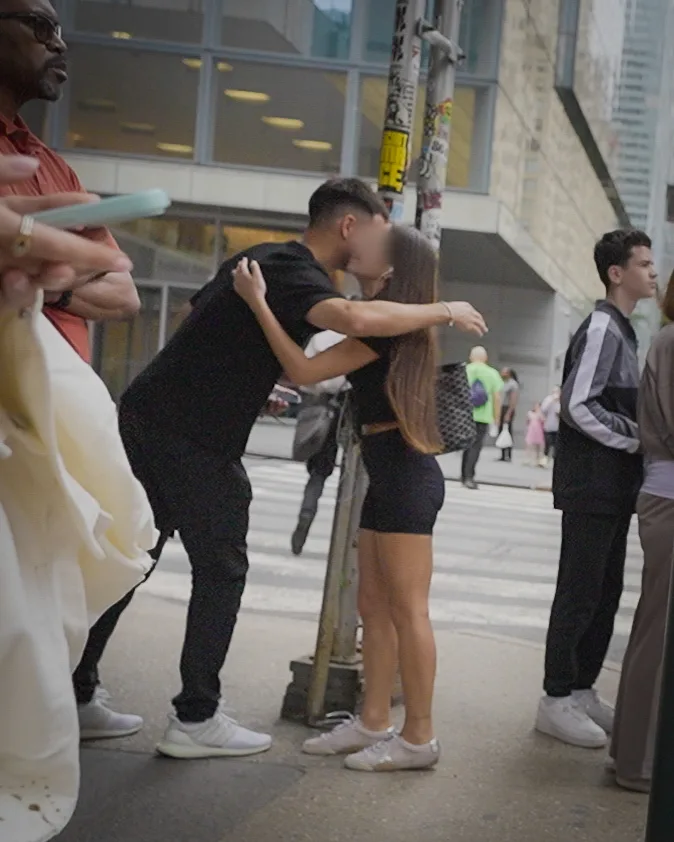 Matt and the same woman hugging goodbye at a crossing.